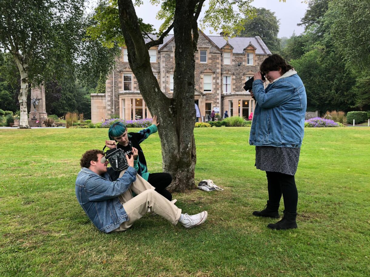 young people holding cameras at a Filmmaking workshop at at Alchemy Film and Arts, Hawick.
